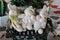 Three Rabbit Dolls On Tiny Bench