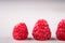 Three raspberry tasty sweet bright on white background copy space macro