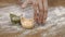 Three raw tortellini on wooden table with a hand, close up of kitchen restaurant