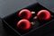 Three red ball ornamental party decoration Christmas in black elegance gift box