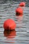 Three red buoys
