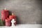 Three red candles on gray background, Christmas decoration. Advent mood.