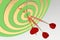 Three red darts hitting the bullseye. 3d illustration