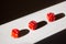 Three red dices in a row on white background with shadow isolated. Command work and leadership concept