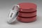 Three red disks in stack and locked steel padlock. Data or database under protection. Concept of data security