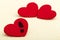 Three red hearts. Concept of broken heart and infidelity