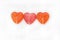 Three Red Lollipops Heart Shape Isoalted on Background. Top view. Love and Valentine& x27;s Day Concept.