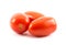 Three red long tomatoes on a white background