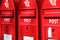 Three red post boxes