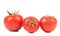 Three red ripe tomatoe.