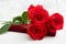 Three Red Roses and jewelery present box with boke Background. copy space - Valentines and 8 March Mother Women's Day concept