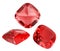 Three red ruby gems on white