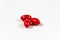 Three red soft gelatine capsules.