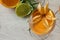 Three Refreshing cold orange cocktails decorated with physalis