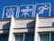 Three retro symbols of sport and culture on urban building roof