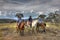 Three riders rider on a mountain