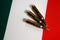 Three rifle cartridges on the flag of Italy. Close-up, copy space