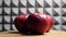 Three ripe gala apples on a rotating wooden table, close-up video. Red apples side view. Fruits on a gray background