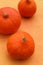 Three Ripe Hokkaido or Butternut Pumpkin on orange colour background. Harvest pumpkins in the garden. Deep orange, tasty