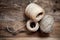 Three rope coils on old wooden background