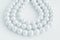 Three rows of natural pearl necklace on white