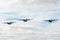 Three Royal Australian Air Force Lockheed Martin C-130J Hercules military cargo aircraft flying in formation