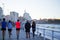 Three runners and pedestrians walking through Paseo de San Lorenzo, in Gijon, Asturias Spain