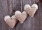 Three sackcloth handmade hearts with lace
