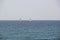 Three Sail Boats on the horizon of the Mediterranean Sea
