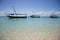 Three sailing boat in blue water