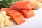 Three salmon pieces on white background