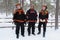 Three Sami men in snow in Lapland, Finland