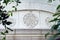 Three sand stone ornaments on the archway