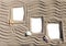 Three sandy photoframes