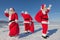 Three Santa Claus outdoors