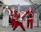 Three Santa Clauses Making Music