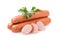 Three sausages with â€‹â€‹slices and fresh parsley isolated