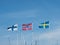 Three Scandinavian flags in a marina