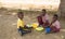 Three school children lunch time in Kenya