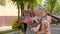 Three school girls with flowers posing for camera. Back to school concept