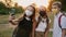Three schoolchildren in protective masks take a selfie