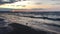 Three seagulls on the empty beach.