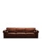 Three-seater soft brown sofa on a white background front view 3d rendering