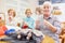 Three senior women crocheting and knitting