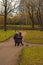 Three seniors engaged in Nordic walking in the Park in late autumn