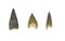 Three serrated stone arrowheads