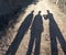 three shadow image of people