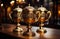 Three Shimmering Gold Trophies on Rustic Wooden Table. Three golden trophies sitting on top of a wooden table