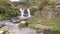 Three Shire Heads. A waterfall and packhorse stone bridge at Three Shires Head in the Peak District National Park