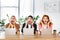 Three shocked friends sitting at table